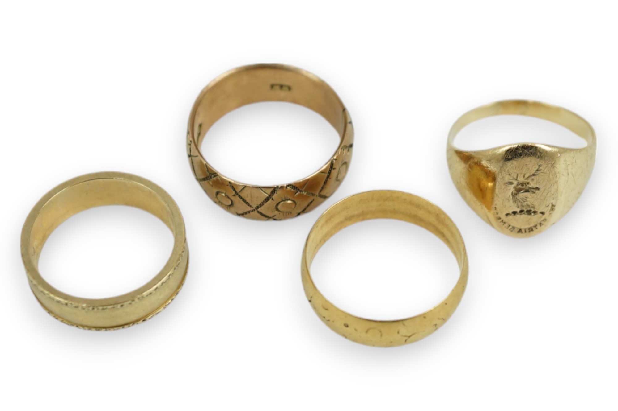 An 18ct gold wedding band, 4.3 grams, two 9ct gold wedding bands, 10 grams and a 14k intaglio signet ring, 3.9 grams.